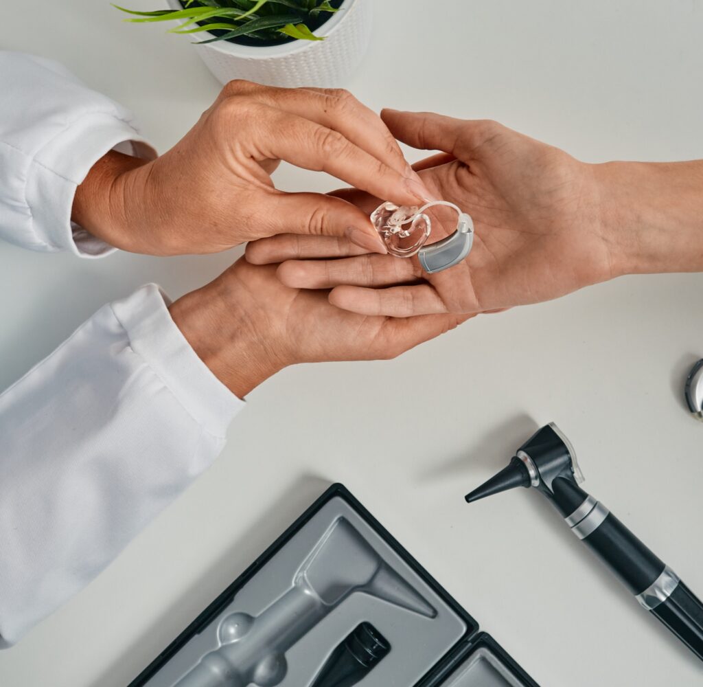 A patient is given hearing aids at Eaton Rapids Medical Center, offering audiology services in Eaton Rapids.