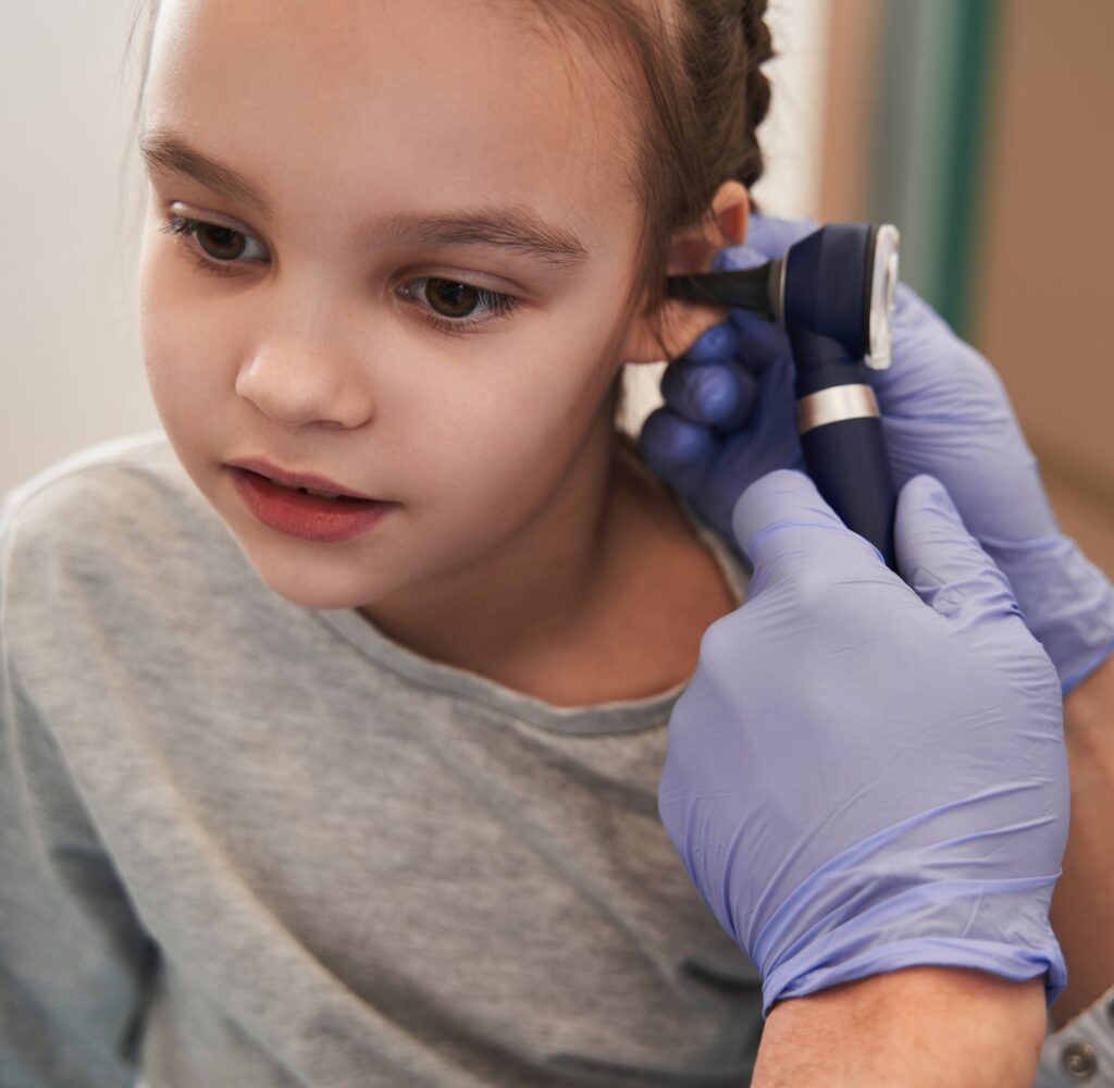 An audiologist consults with a child patient at Eaton Rapids Medical Center, offering audiology services in Eaton Rapids.